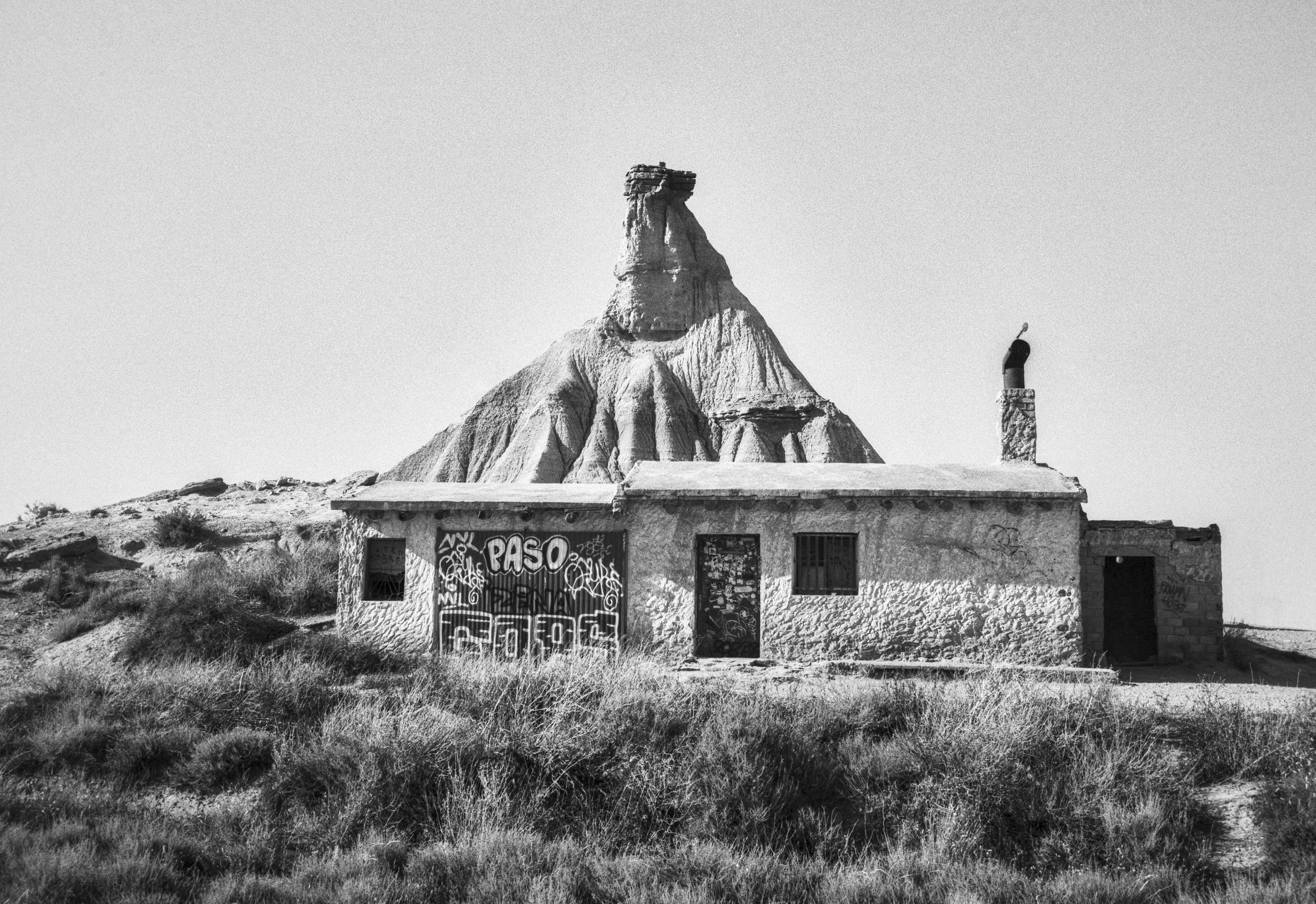 Small abandoned hut in front of the Castildetierra formation in the Bardenas Reales desert.